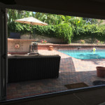 ZigZag Retractable Screen Door on Bifold Opening - Enjoy the Pool From the Inside